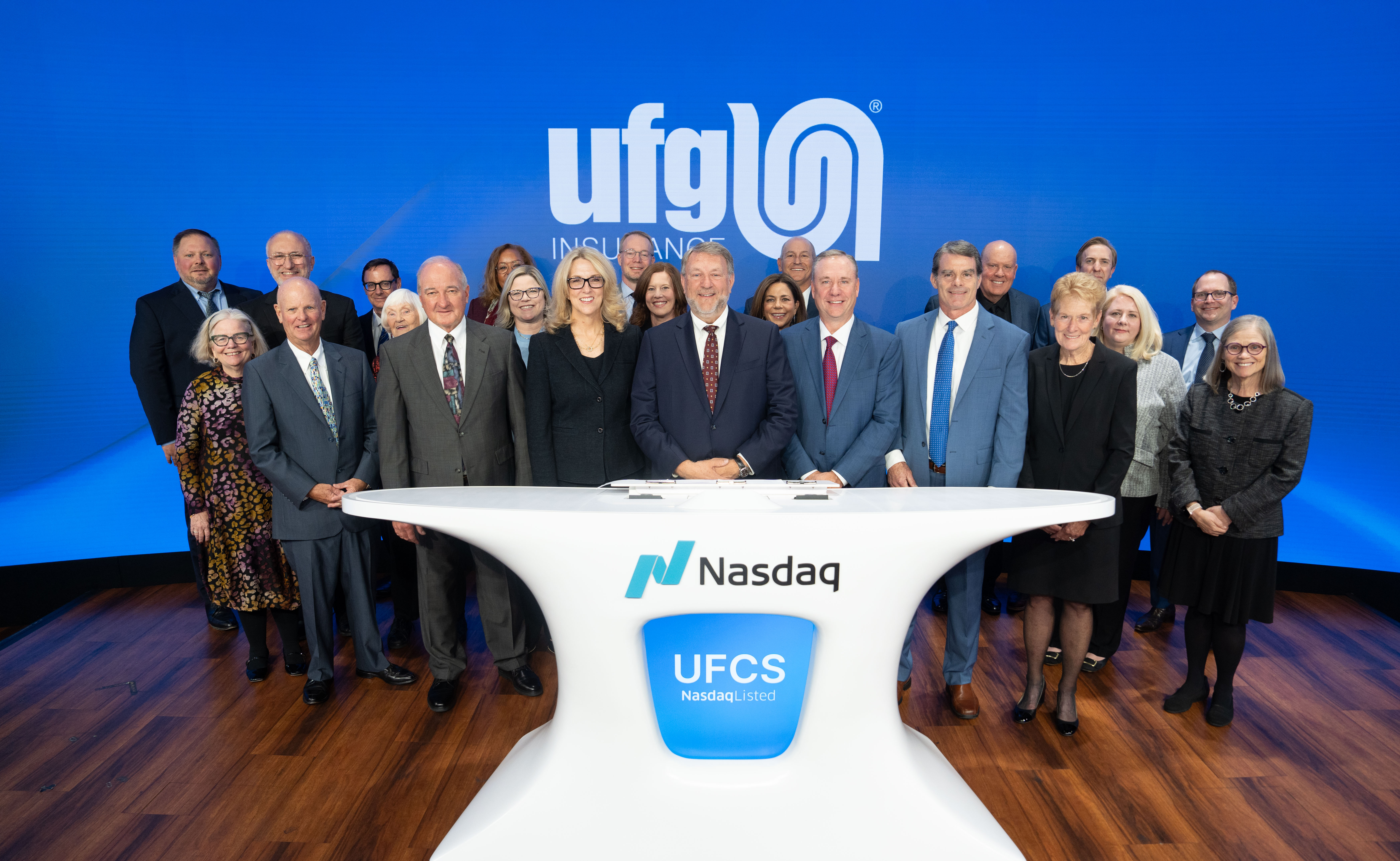 UFG at Nasdaq Group of people at Nasdaq bell ceremony